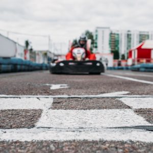 Karting racer on finish line, go kart competition