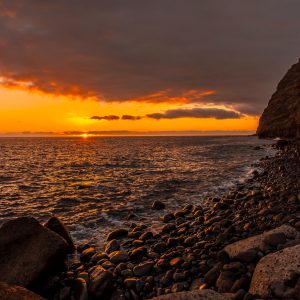 Orange sunset on the beach of Puerto de Tazacorte on the island of La Palma, Canary Islands